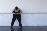 Carol Squires warming up before a rehearsal  session of the Phat Fly Girls, a hip hop performing ensemble featuring fat dancers.  The  Phat Fly Girls shows are produced by Big Moves, the only service organization in the world dedicated to promoting size diversity in dance.   The pro-fat acceptance movement promotes body-acceptance and fitness at any size. It fights to eliminate discrimination based on body size and provide fat people with the tools for self-empowerment
