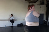 Carol Squires warming up before a rehearsal  session of the Phat Fly Girls, a hip hop performing ensemble featuring fat dancers.  The  Phat Fly Girls shows are produced by Big Moves, the only service organization in the world dedicated to promoting size diversity in dance.   The pro-fat acceptance movement promotes body-acceptance and fitness at any size. It fights to eliminate discrimination based on body size and provide fat people with the tools for self-empowerment