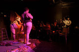 Performers during the Fat-Bottom Revue, a burlesque show featuring fat artists in a mixture of classic stripper-jazz numbers and erotic comedy. The show is produced by Big Moves, a San Francisco Bay Area organization that promotes size diversity in the dance world.   The pro-fat acceptance movement promotes body-acceptance and fitness at any size. It fights to eliminate discrimination based on body size and provide fat people with the tools for self-empowerment