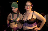 Heather MacAllister, better known as Ms. DeMeanor,  (L) and Marina Wolf at the end of the Fat-Bottom Revue, a burlesque show featuring fat artists in a mixture of classic stripper-jazz numbers and erotic comedy. The show is produced by Big Moves, a San Francisco Bay Area organization that promotes size diversity in the dance world.                      The pro-fat acceptance movement promotes body-acceptance and fitness at any size. It fights to eliminate discrimination based on body size and provide fat people with the tools for self-empowerment